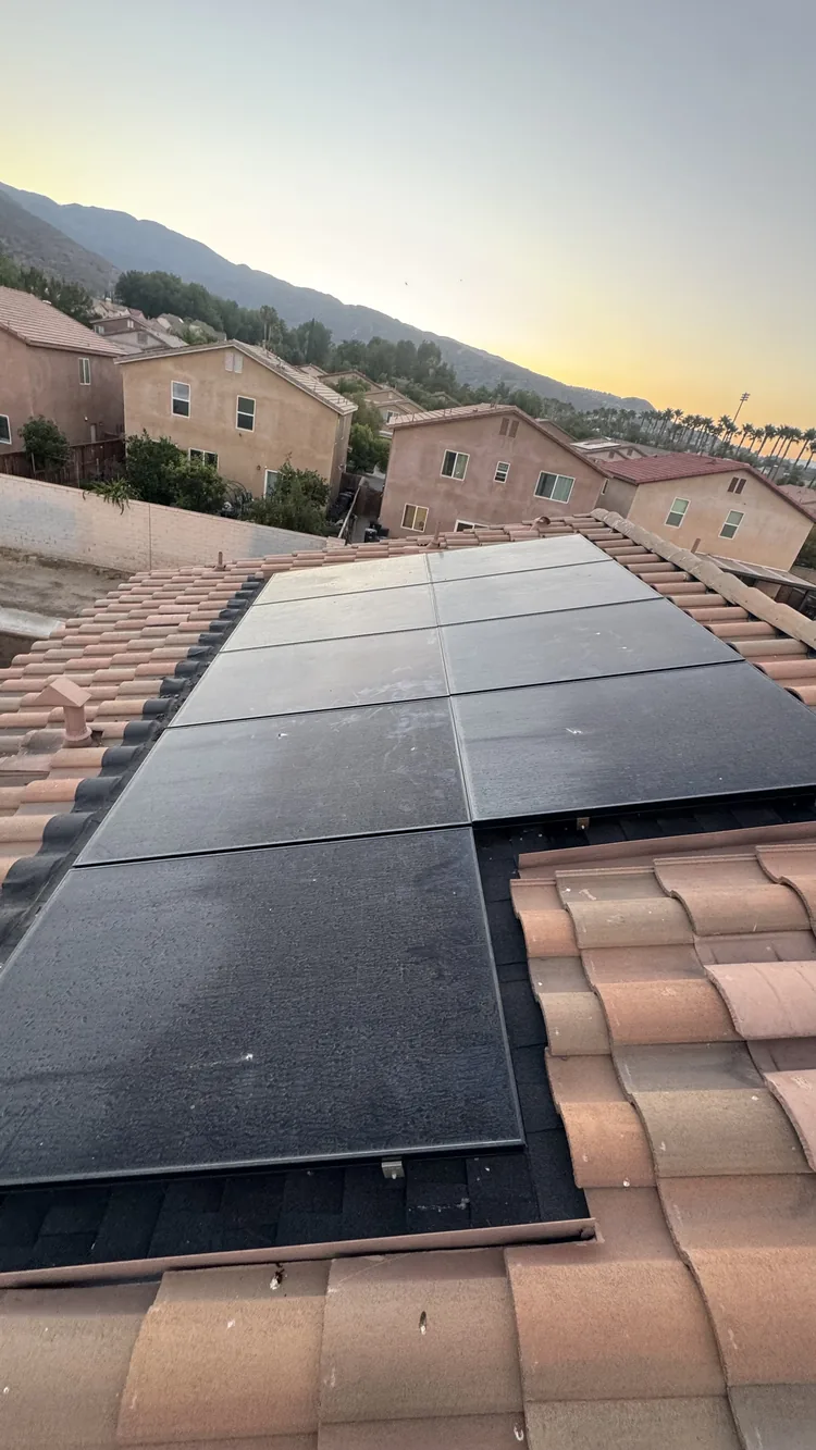 Solar panels viewed from the roof, looking clean and ordinary